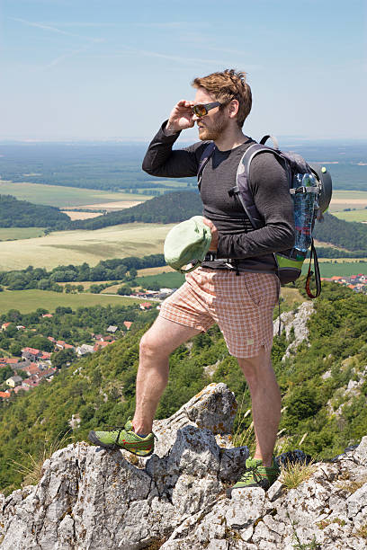 istock Man on the top of rock 487166626