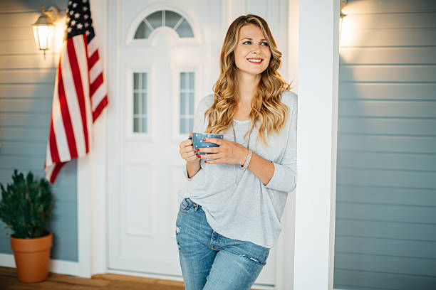 istock Woman in front of a house. 487166842