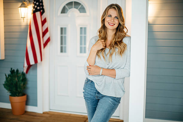 istock Woman in front of a house. 487166850