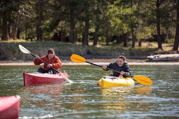 istock Young adult kayaking on river 487167112
