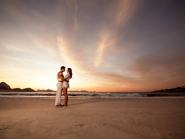 istock Young loving couple having a romantic moment on the beach. 487169016