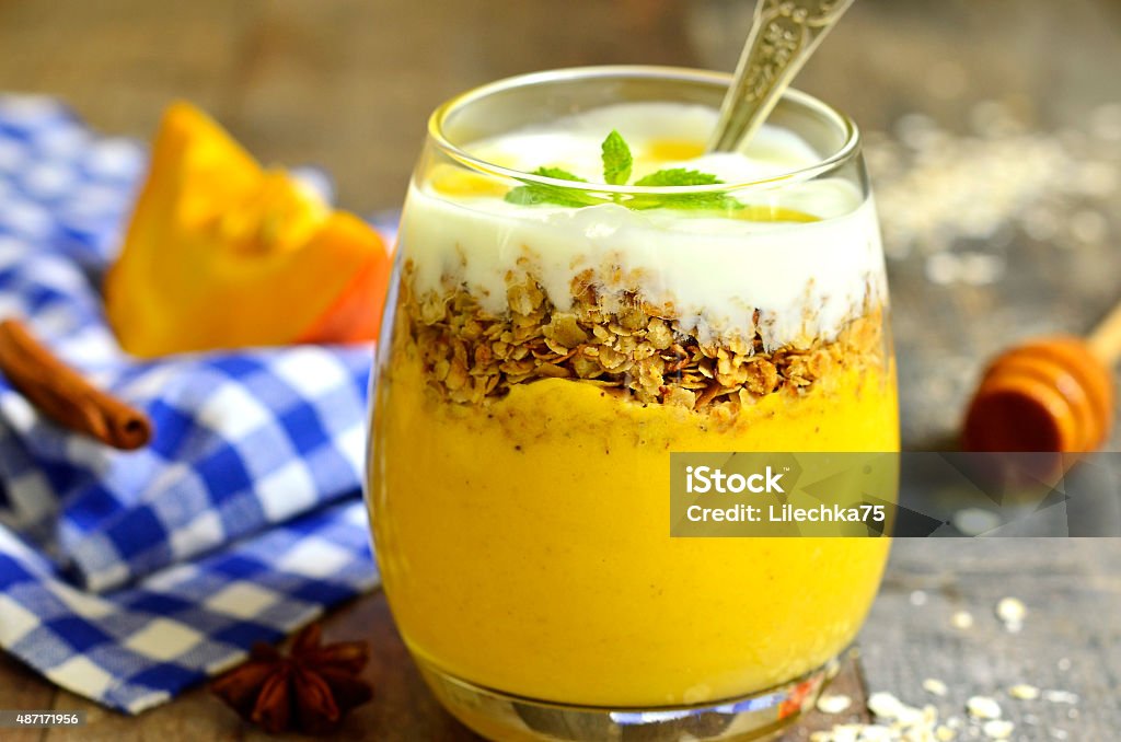 Pumpkin smoothie with granola and yogurt. Pumpkin smoothie with granola and yogurt - healthy breakfast. 2015 Stock Photo