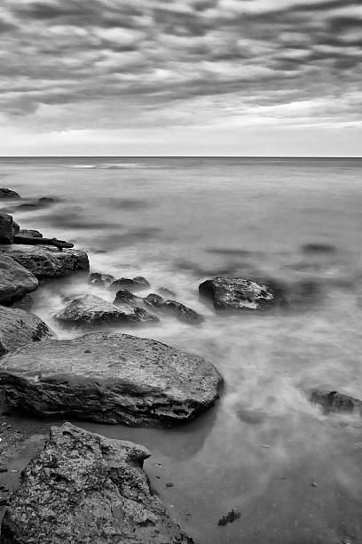 istock Gloomy sea stones before the evening storm 487172834
