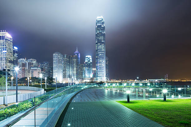 istock pathway in the night with modern city background 487173103