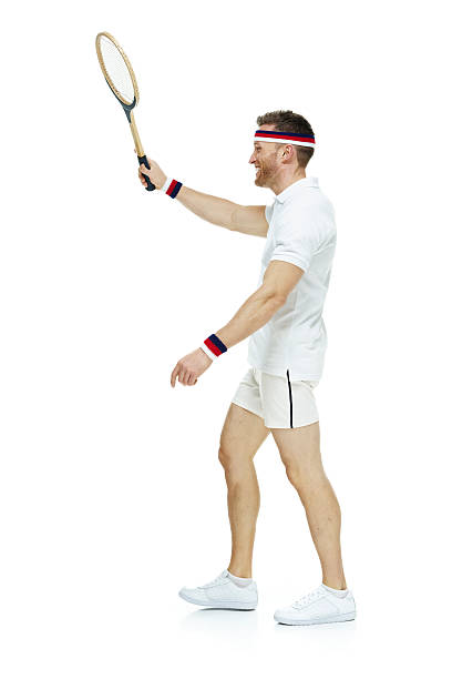 istock Smiling tennis player walking 487173354