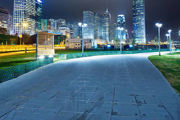 istock pathway in the night with modern city background 487173427