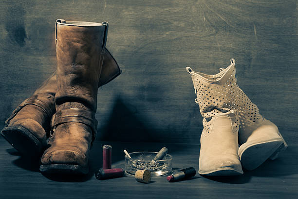 istock women's and man's boots on old wooden 487174237