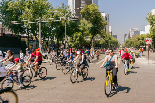 Mexico City, Mexico - April 13, 2014: Bikers at the Mexico City sunday ride along Paseo de la Reforma. On sundays the avenue is closed to transit and is full of bikers, runners and families working out or doing outdoors activities.