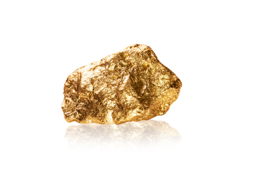 Gold nugget isolated on white background.