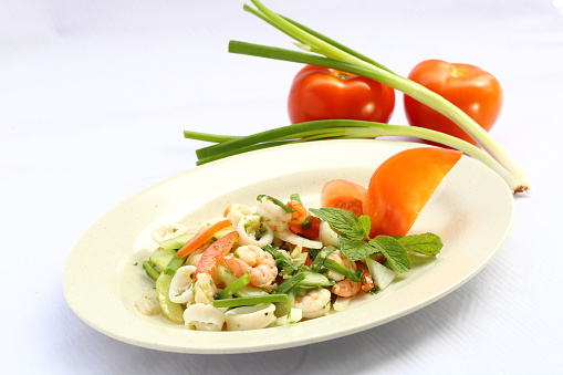 Asian seafood salad with prawn calamari spring onion mint tomato