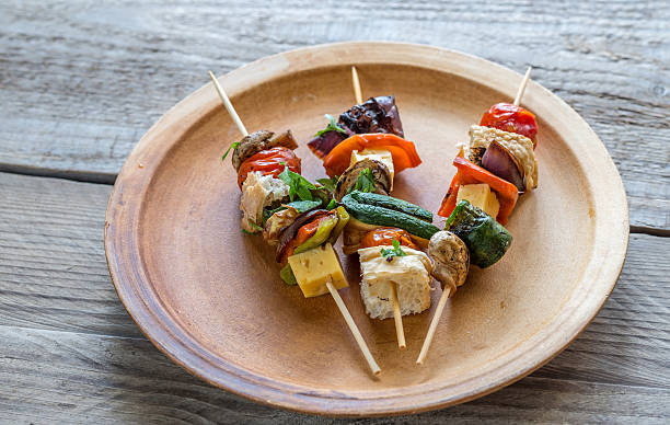 istock Grilled vegetable skewers on the plate 487178134