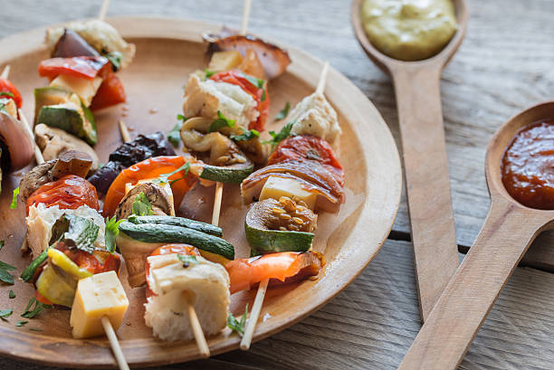 istock Grilled vegetable skewers on the plate 487178136