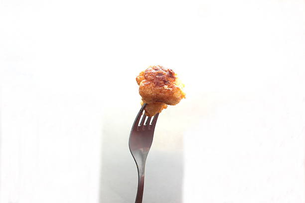 istock piece of fried cauliflower 487178162