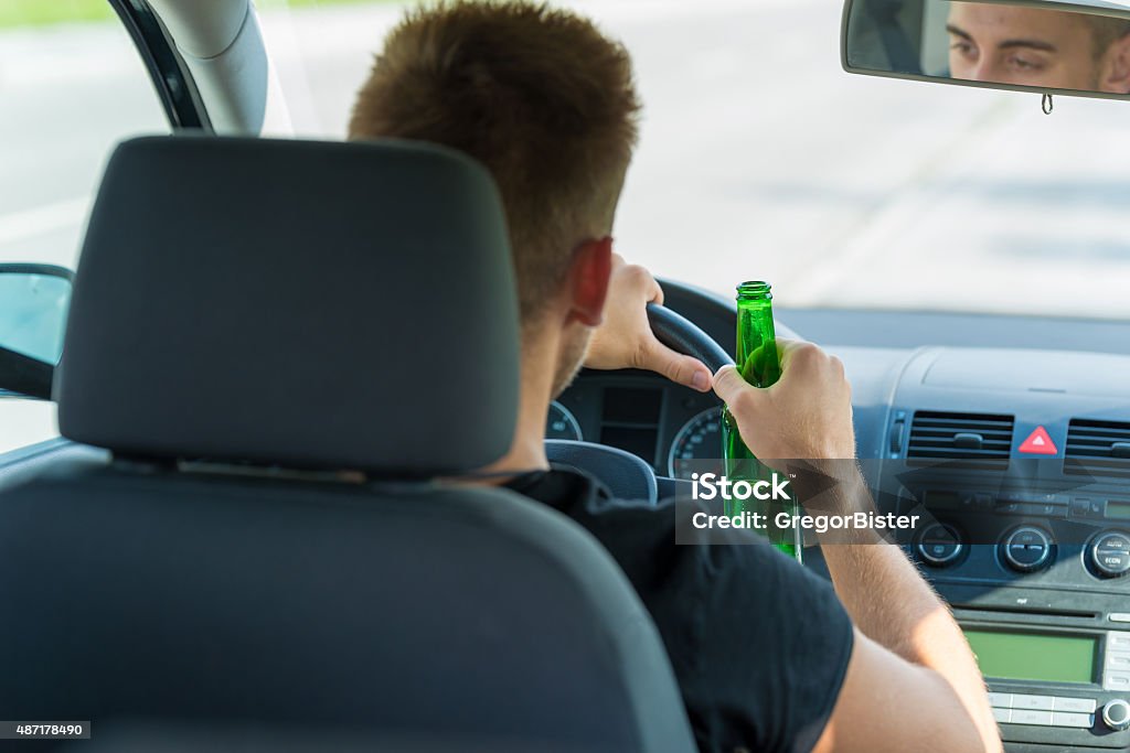 Can I Drink Na Beer While Driving Drinking Beer While Driving A Car Stock Photo - Download Image Now