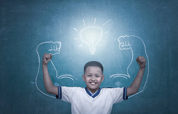 istock asian strong children against blackboard in classroom, Education 487178570