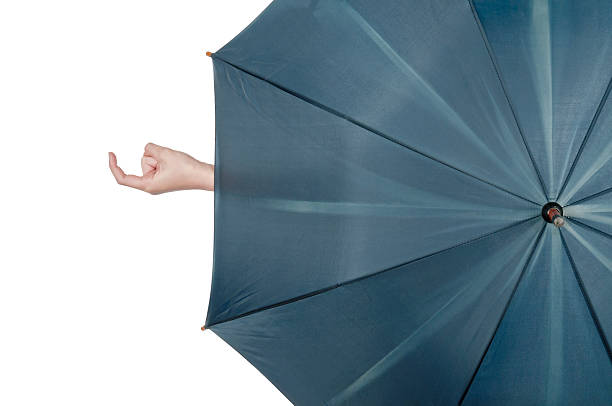 istock Young woman calling hand sign behind umbrella 487179001
