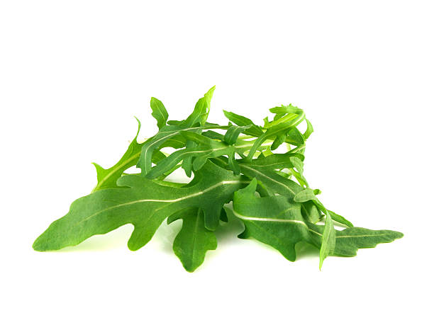 istock Arugula, rucola fresh heap leafs isolated on white 487180265