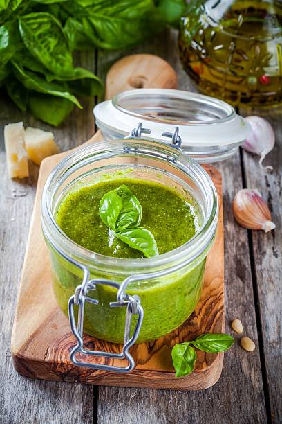 istock homemade pesto in a glass jar 487180948