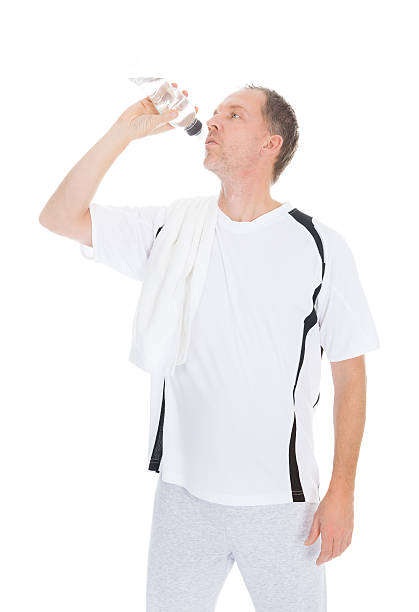 istock Happy Mature Man Holding Water Bottle 487182146