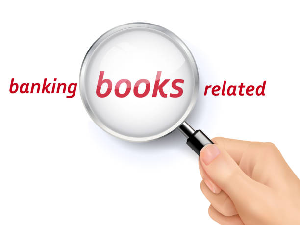 istock banking books related words showing through magnifying glass 487183016