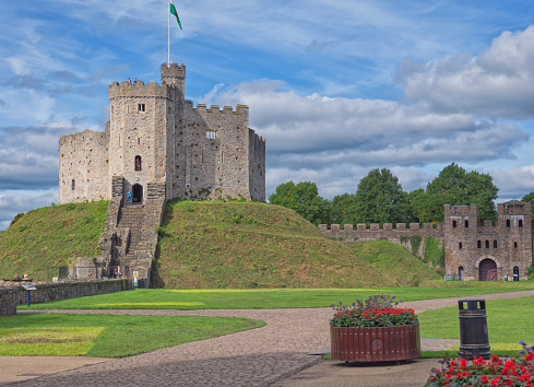 Cardiff, Wales, UK - 5 OCT. 2013: Unidentified visitors in the courtyard of Cardiff Castle, Wales. The castle which is built on a Roman site has a rich history and has become one of Wales's most popular visitor attractions