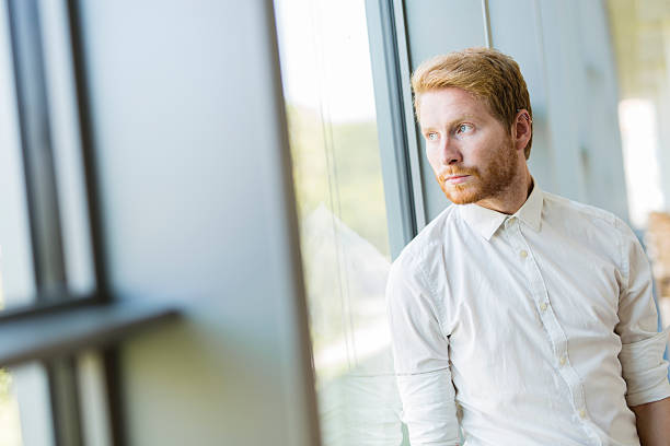 istock Successful businessman standing by the window 487186966