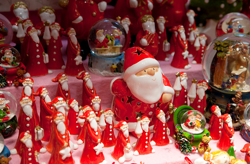 Santa Clause glass figurines for sale at traditional  Christmas Market in Nuremberg, Germany