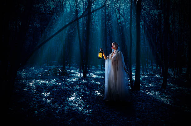 istock Elven girl in night forest 487190816