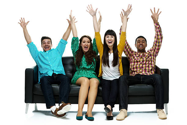 istock Four friends sitting of sofa 487195612