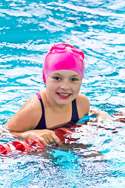 istock Cute girl in swimming pool 487195890