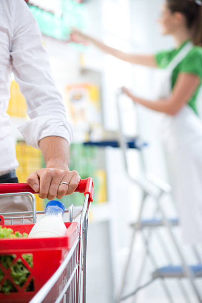 istock Customer at supermarket hands close-up 487199788