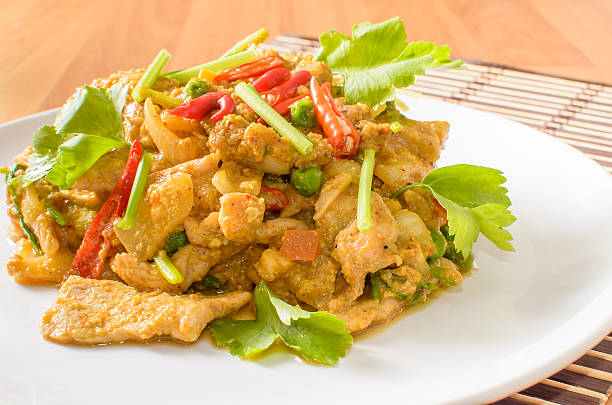 istock Stir fried pork spicy yellow curry with vegetable 487200739