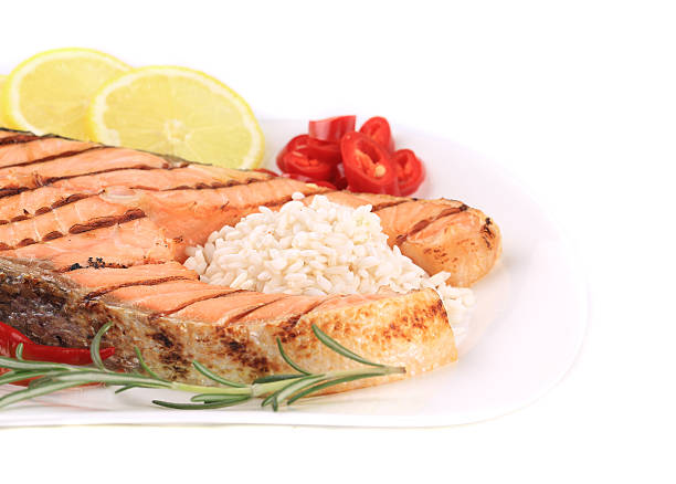istock Grilled salmon steak with vegetables on plate. 487201137