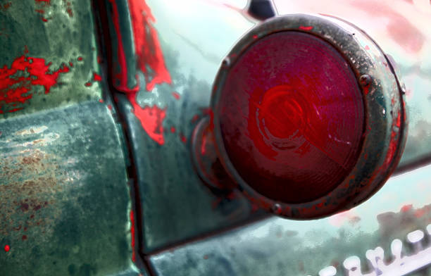 Rusted car door with red head tail light