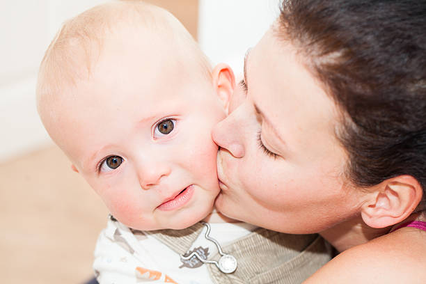 istock Little cute child boy with her mother 487201958