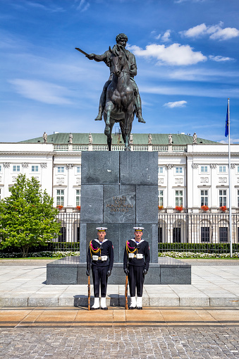 Warsaw, Poland - August 01, 2015:Polish honour guard at the Monument of the Prince Józef Antoni Poniatowski in front of the presidential palace, Warsaw, Poland 