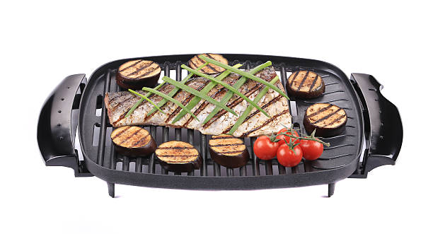 istock Grilled carp fillet on grill with egg plant. 487203999