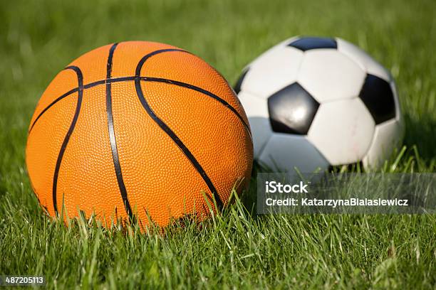 Two Ball In The Grass Stock Photo - Download Image Now - Activity, American Football - Ball, Arts Culture and Entertainment