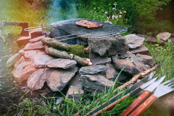 Outdoor life, grilling a steak on the campfire
