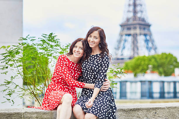 istock Twin sisters in front of the Eiffel tower in Paris 487205270