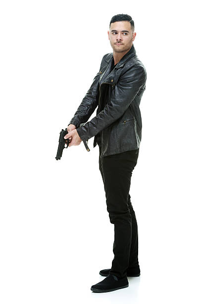 istock Casual man holding handgun 487205396