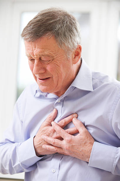 istock Senior Man Suffering Heart Attack At Home 487205883