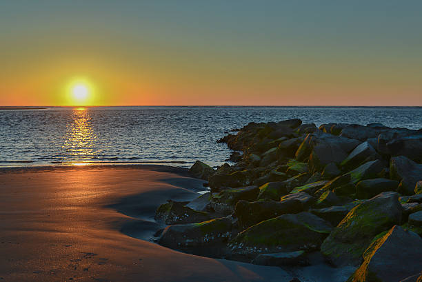 An early morning shot of the sun rising over the ocean on Sullivan's Island, South Carolina