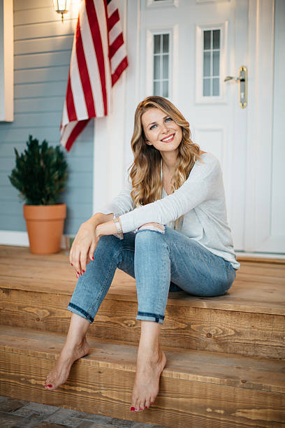 istock Woman in front of a house. 487206382