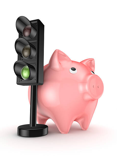 istock Traffic light and pink piggy bank. 487206824