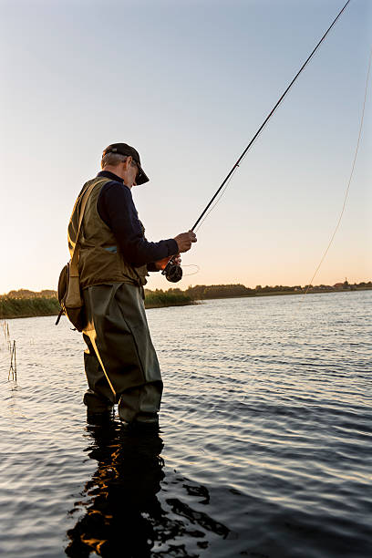 istock Fly Fisherman Casting Out His Line 487207064