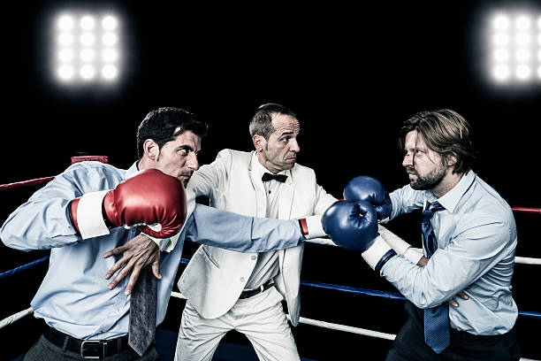 Businessman fight businessman fight in boxing ring boxing referee stock pictures, royalty-free photos & images