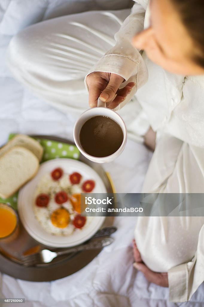 coffee zoung woman having breakfast in bed 2015 Stock Photo