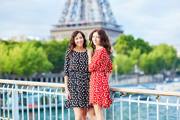 istock Twin sisters in front of the Eiffel tower in Paris 487210942