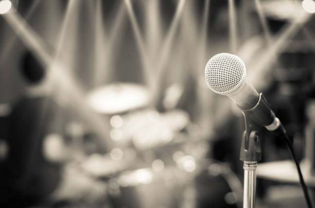 istock Close up of microphone on musician blurred background 487214808